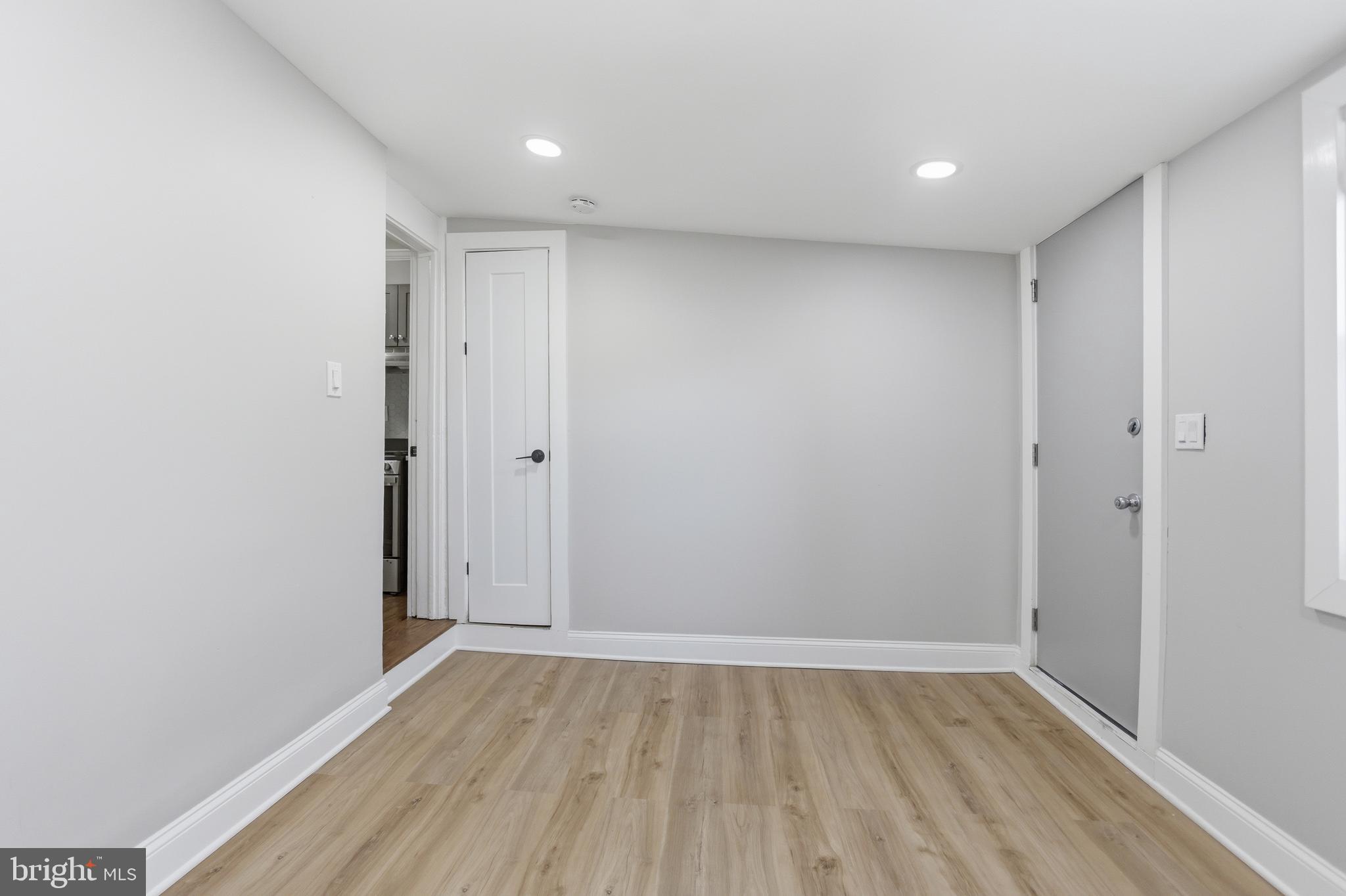 1250 Holbrook Terrace Northeast, Unit 3 Washington, DC 20002 - Photo 2 of 12 a view of an empty room with wooden floor