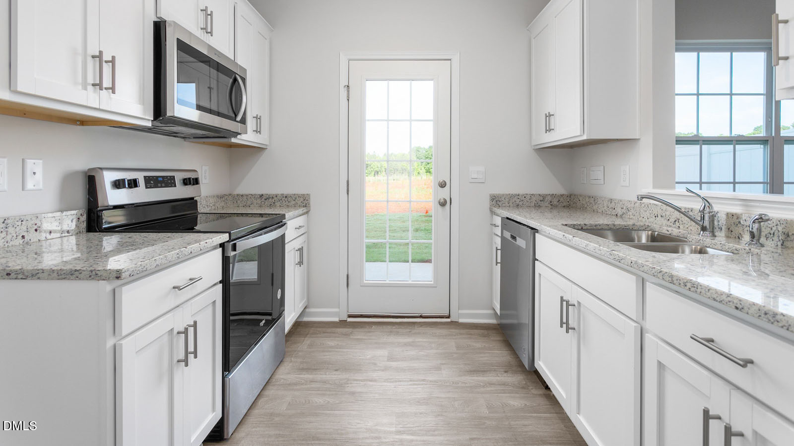 168 Canopy Drive Graham, NC 27253 - Photo 31 of 44 a kitchen with stainless steel appliances granite countertop a sink stove and cabinets