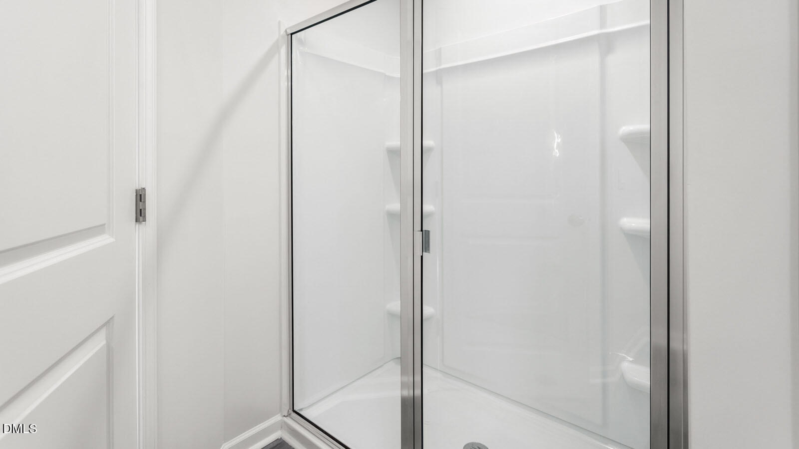 168 Canopy Drive Graham, NC 27253 - Photo 16 of 44 a bathroom with a glass shower door