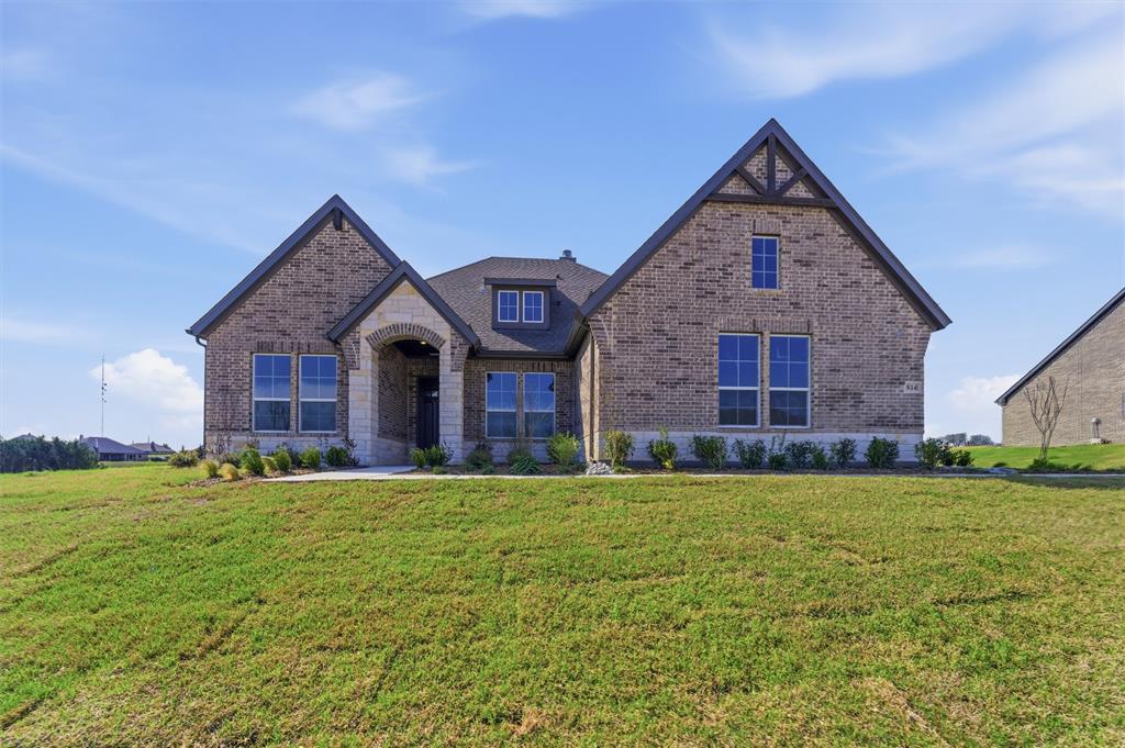814 Vly Rdg Road Van Alstyne, TX 75495 - Photo 2 of 24 a view of a house with a yard