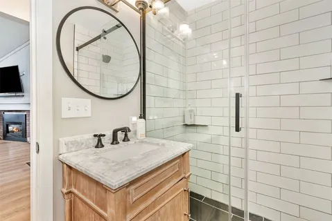 a bathroom with a sink a mirror and a sink