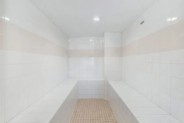a kitchen with a sink appliances and cabinets