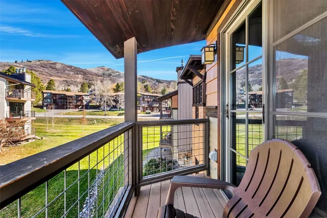 a view of balcony with furniture