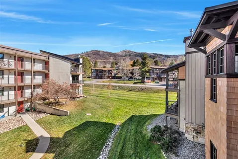a view of a swimming pool with a yard