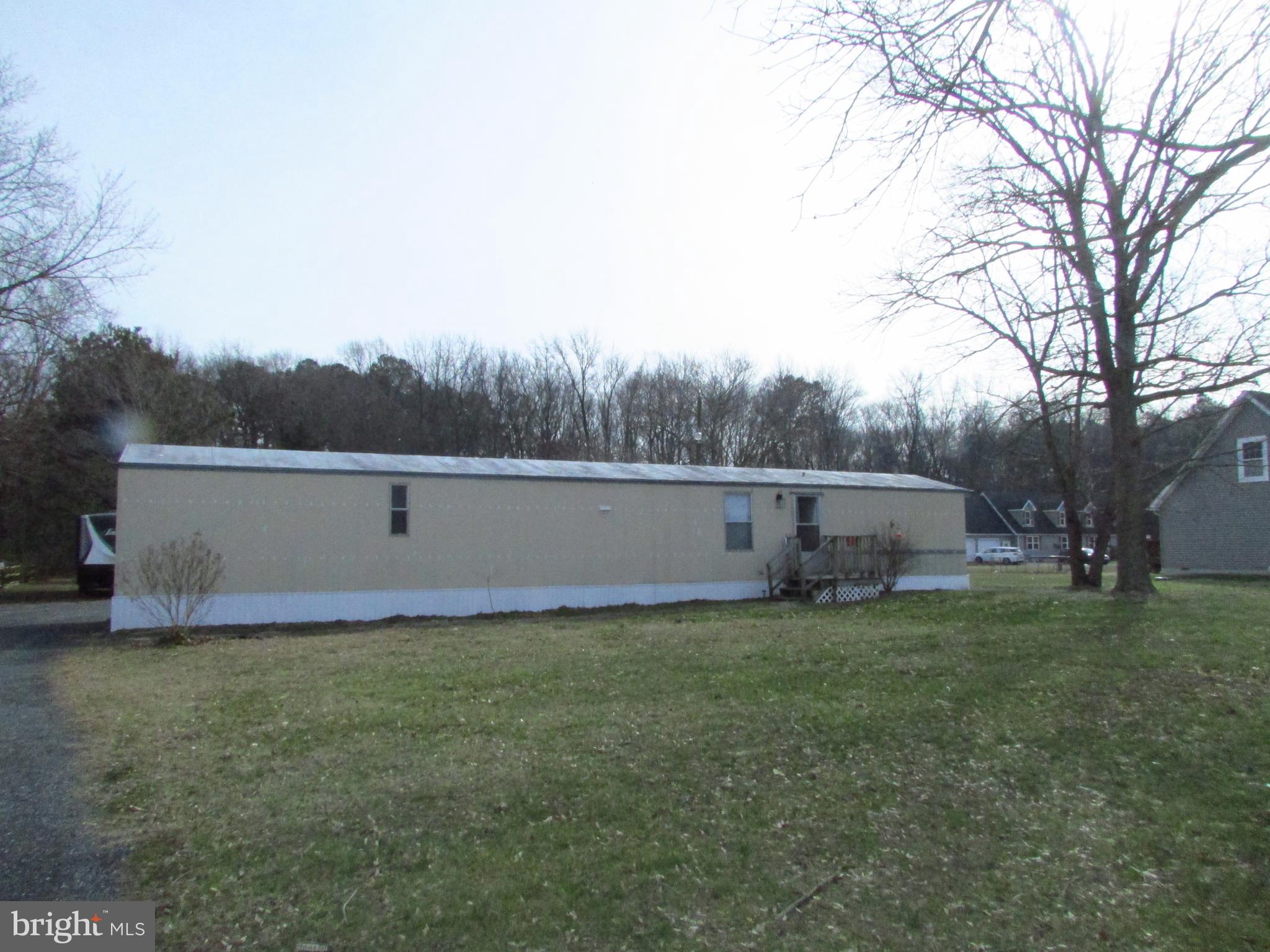 24995 Kruger Road Georgetown, DE 19947 - Photo 2 of 6 a view of a backyard