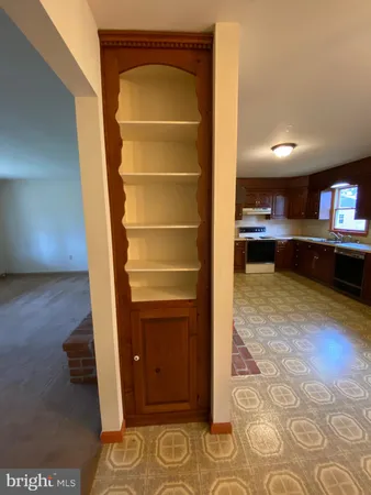 a view of a livingroom with furniture and staircase