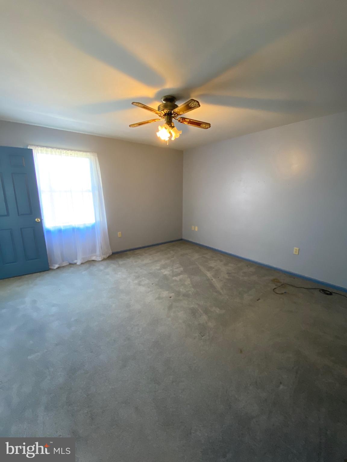 11 Creeks Edge Road Oley, PA 19547 - Photo 16 of 28 an empty room with windows and fan