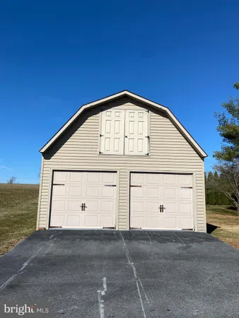 a view of an empty room with a garage