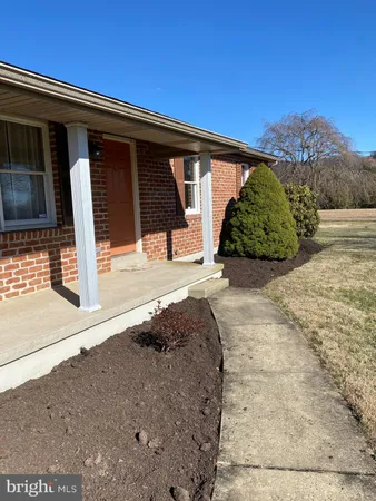 a view of a backyard of a house