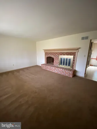 a view of livingroom and fireplace