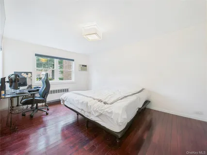 a bathroom with a granite countertop bathtub sink and toilet