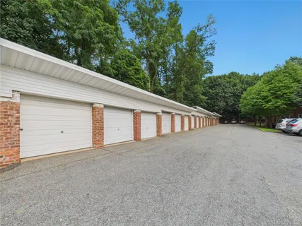 a view of car parked in front of a house