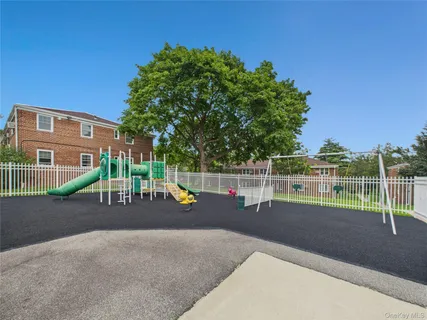 a view of a yard with a house in the background