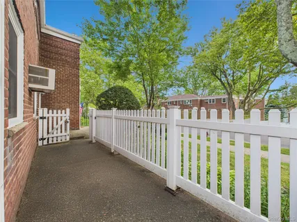 a view of a brick house with a large window