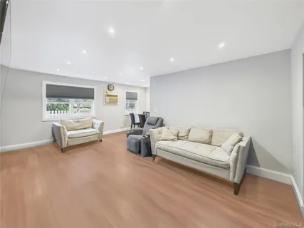 a living room with furniture white walls and white walls