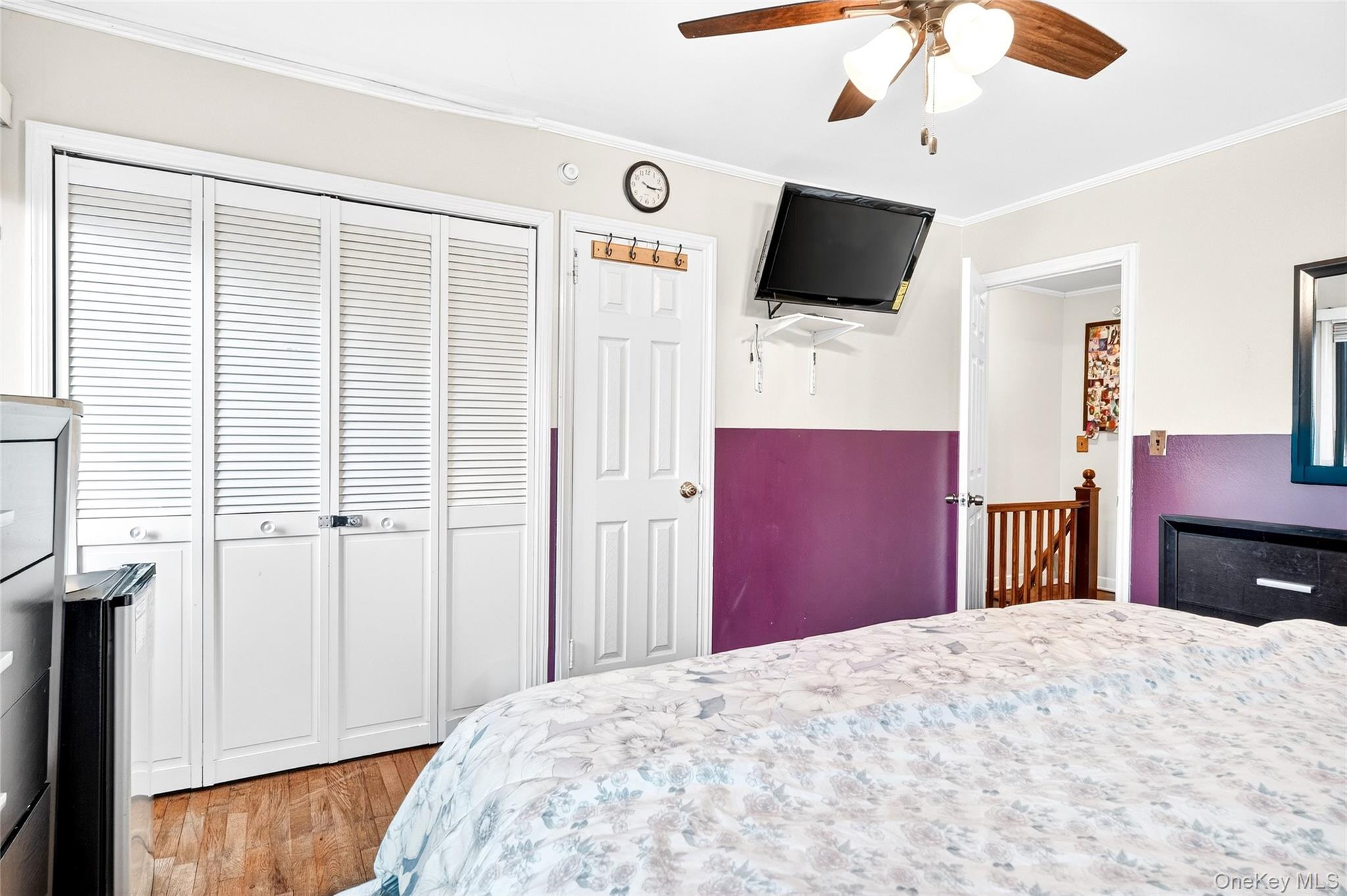 3062 Harding Avenue Bronx, NY 10465 - Photo 23 of 34 a bedroom with a bed and a flat screen tv