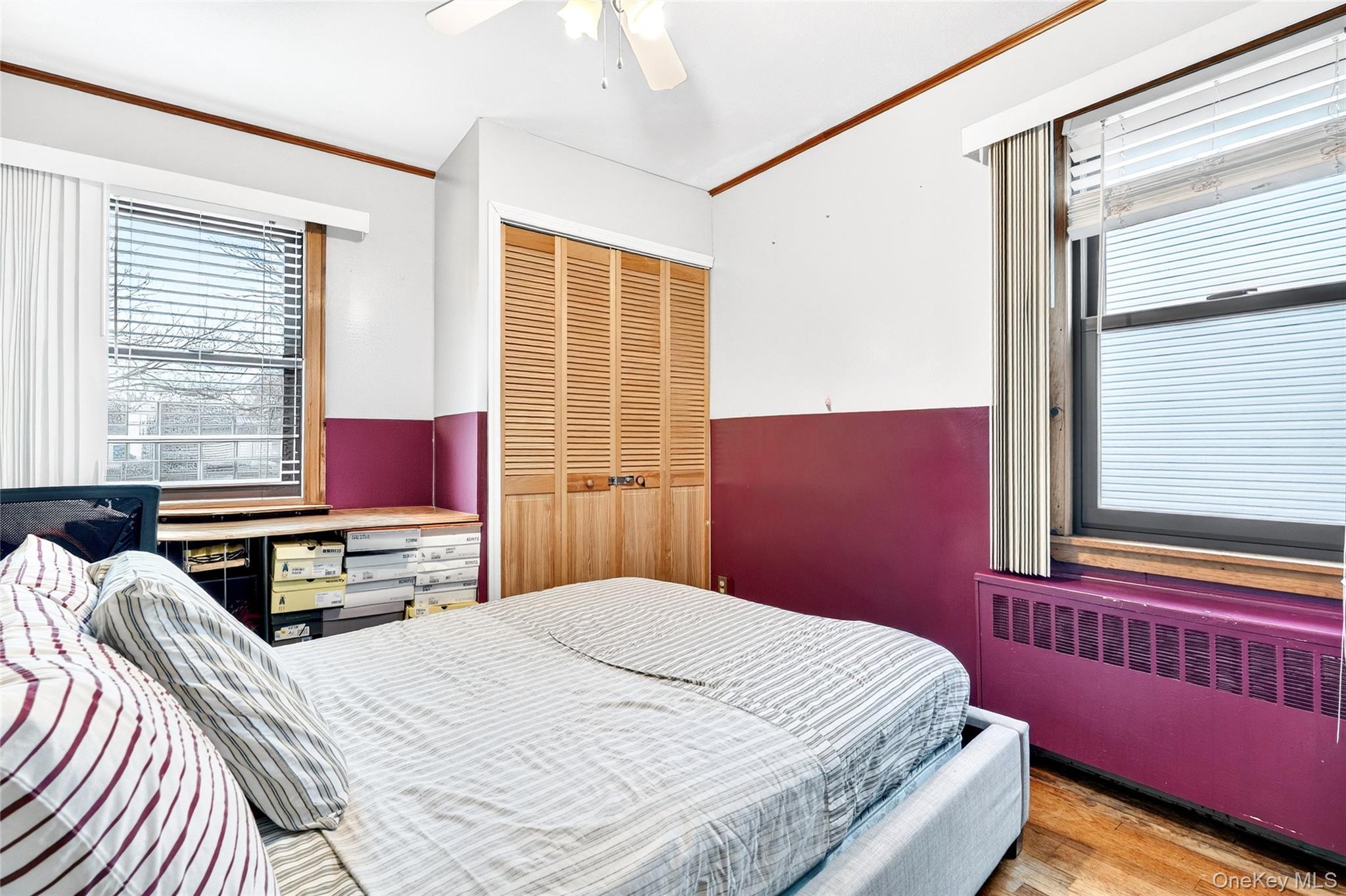 3062 Harding Avenue Bronx, NY 10465 - Photo 24 of 34 a bedroom with a bed and wooden floor