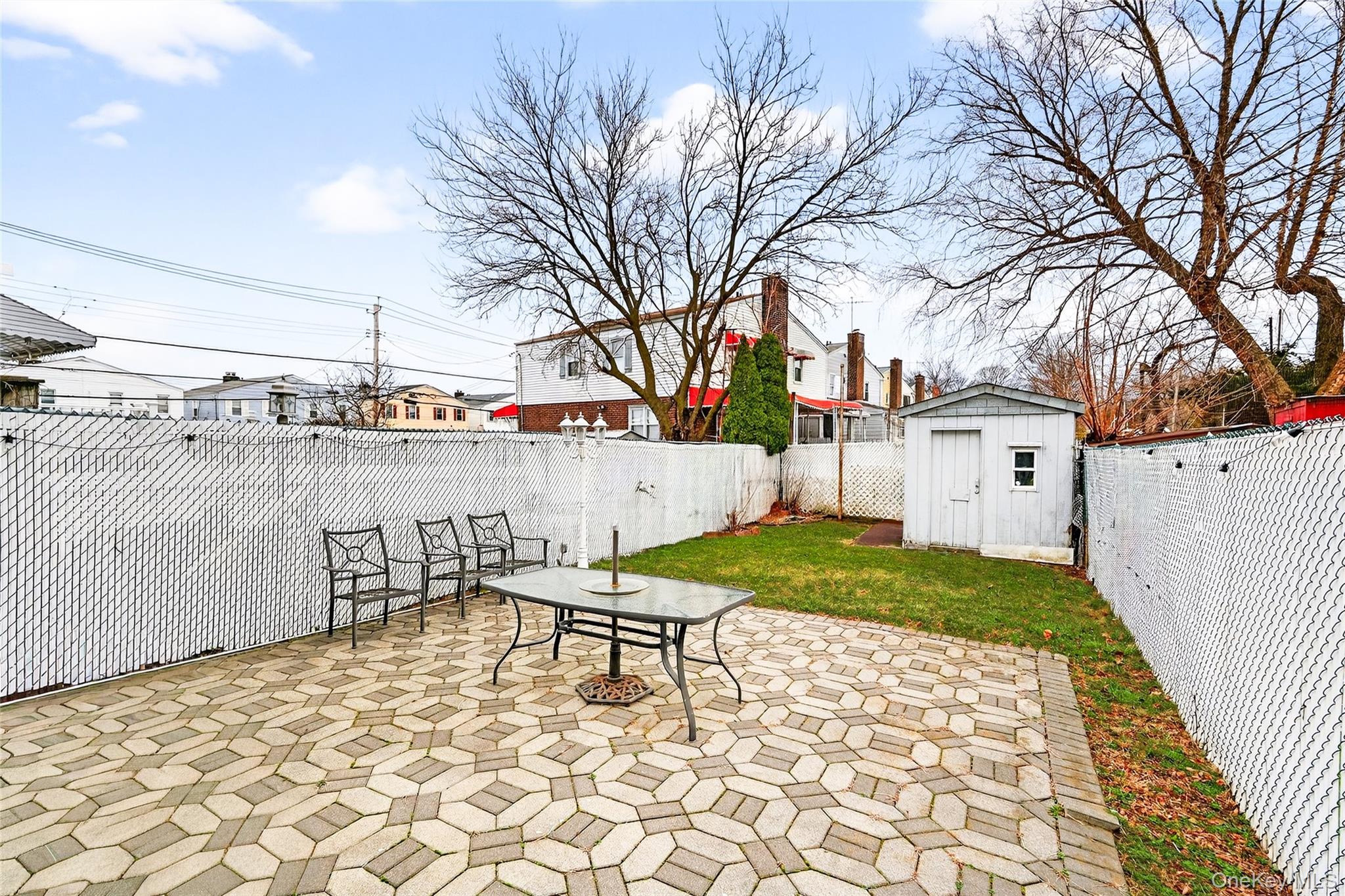 3062 Harding Avenue Bronx, NY 10465 - Photo 10 of 34 a backyard of a house with table and chairs