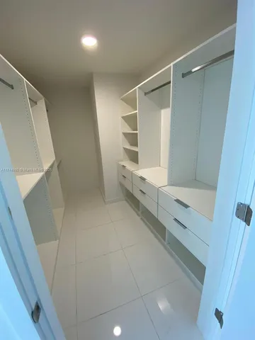 a bathroom with a shower and a sink