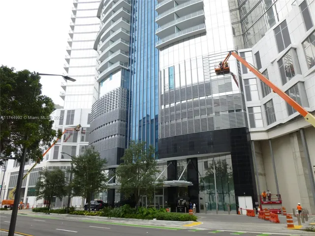 a view of a hallway with seating area
