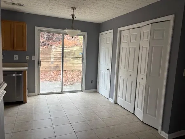 a view of an empty room with a window