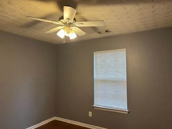 a view of a small space with a fan