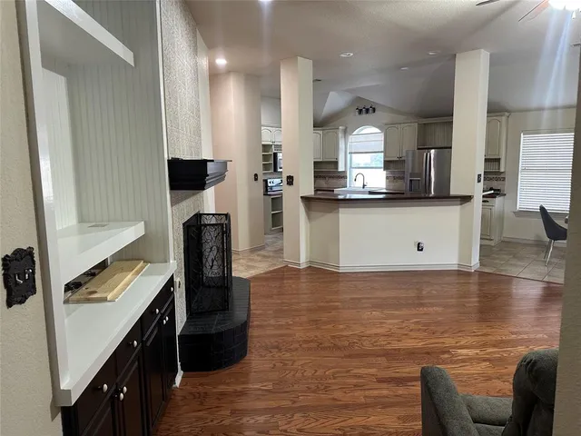 a living room with furniture and a fireplace