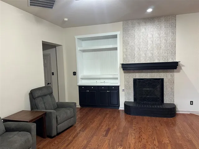 a large kitchen with sink a refrigerator and a stove