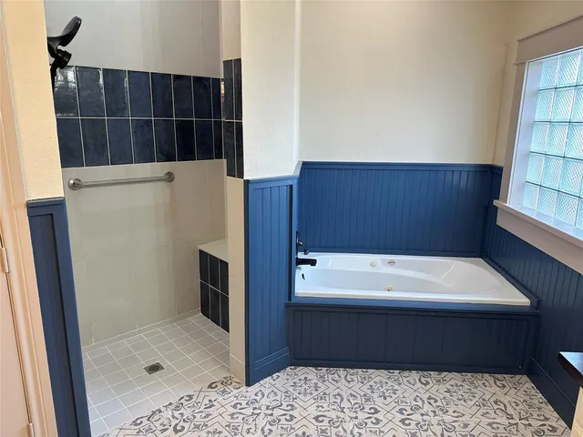 a bathroom with a sink a mirror and a shower