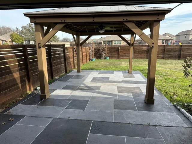 a view of a backyard of the house