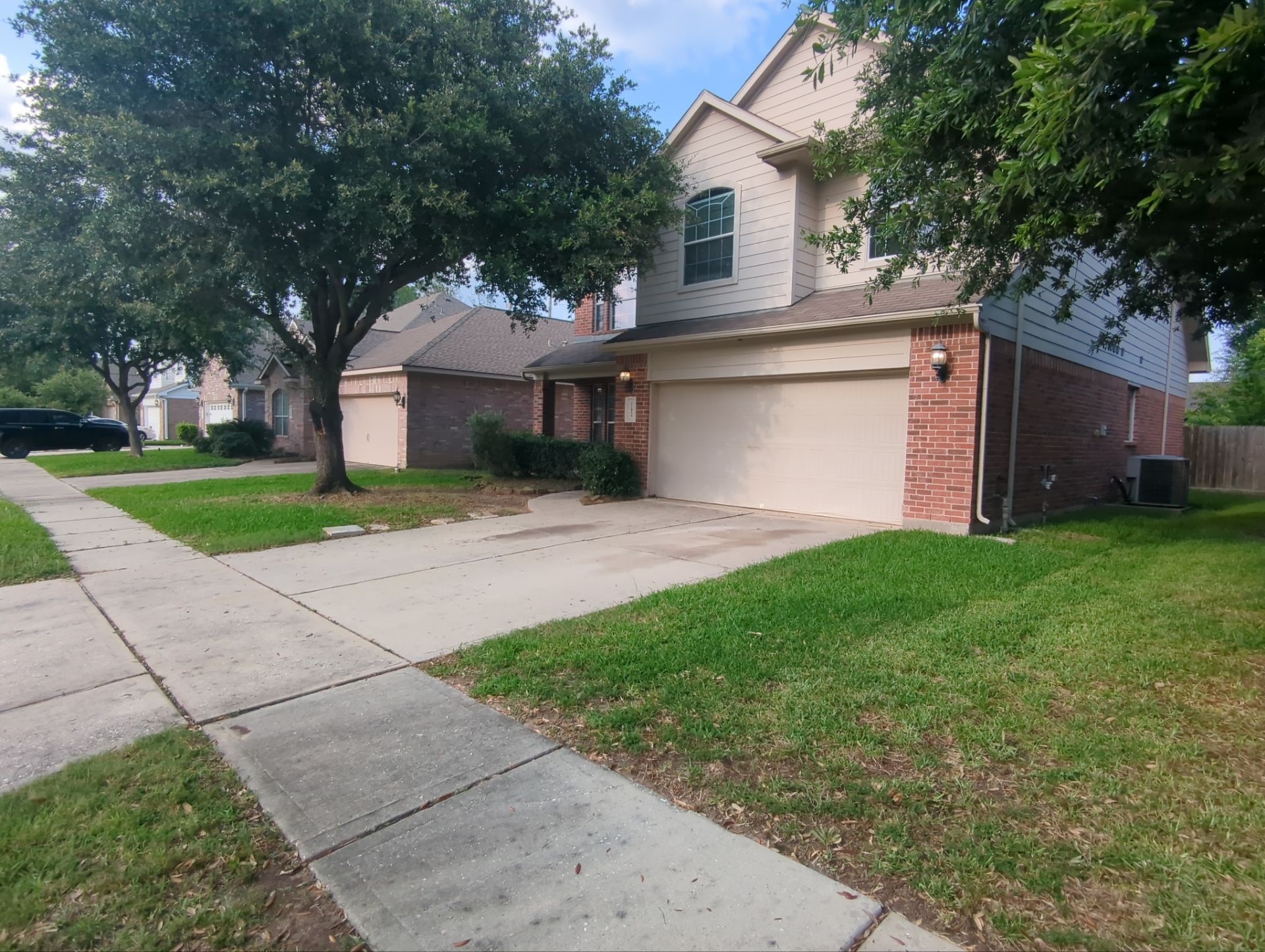 21850 Catoosa Drive Spring, TX 77388 - Photo 2 of 15 a front view of house with yard and green space