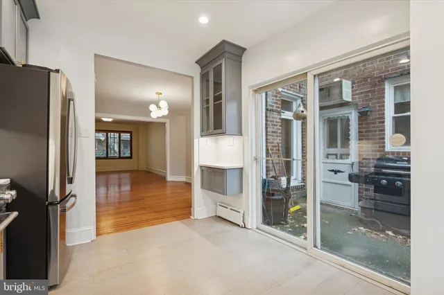 a view of a hallway with wooden shelves