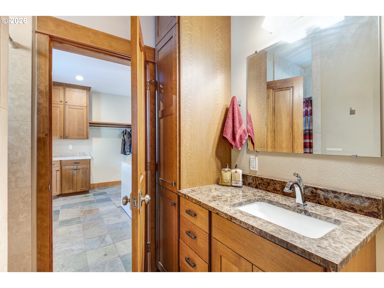 61615 High Valley Road Union, OR 97883 - Photo 23 of 47 a bathroom with a granite countertop sink and a mirror