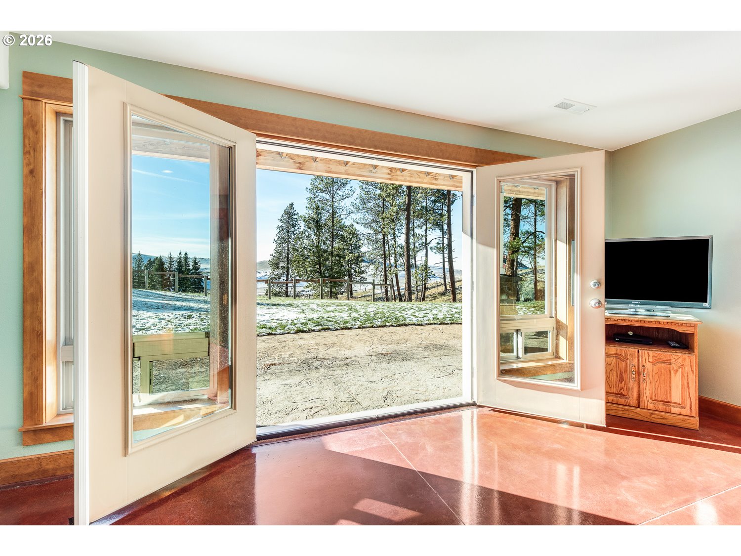 61615 High Valley Road Union, OR 97883 - Photo 32 of 47 a view of an empty room with wooden floor and a window