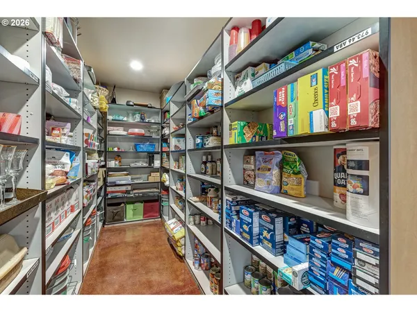a kitchen with a refrigerator and a sink
