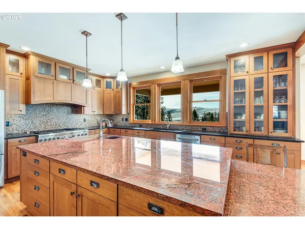 a kitchen with large windows