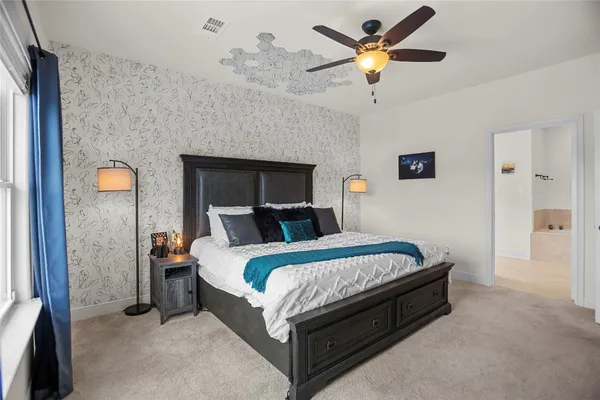 a bed room with a bed and a chandelier