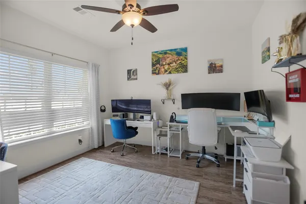 a workspace with furniture hardwood and a window
