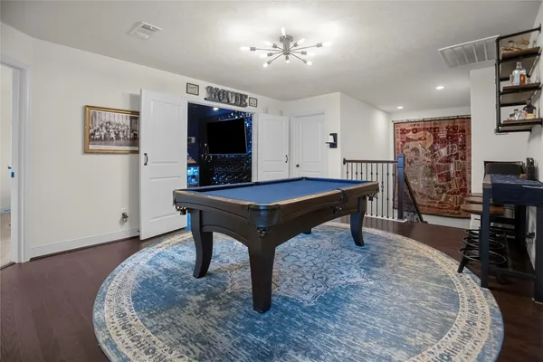 a room with furniture and a flat screen tv