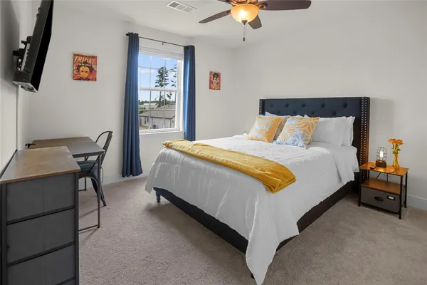 a bed room with a bed and a table