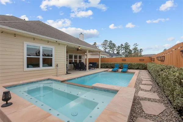 a view of house with swimming pool