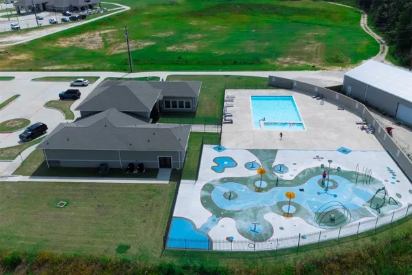 an aerial view of a house with swimming pool garden and outdoor space