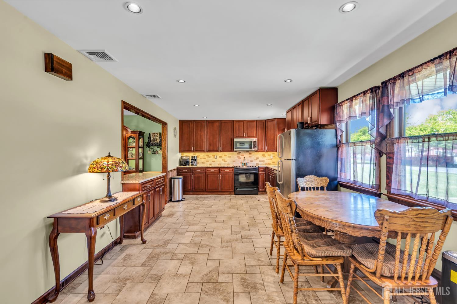 99 Schulmeister Road Old Bridge, NJ 08857 - Photo 4 of 49 a large kitchen with a table and chairs in it