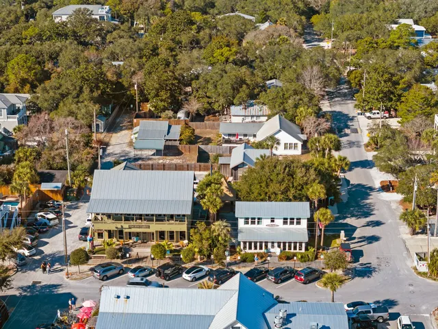 an aerial view of a house with parking space