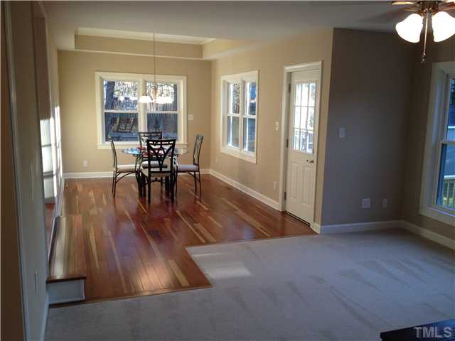 4005 Pleasant Grove Church Road Raleigh, NC 27613 - Photo 4 of 11 an empty room with wooden floor and furniture