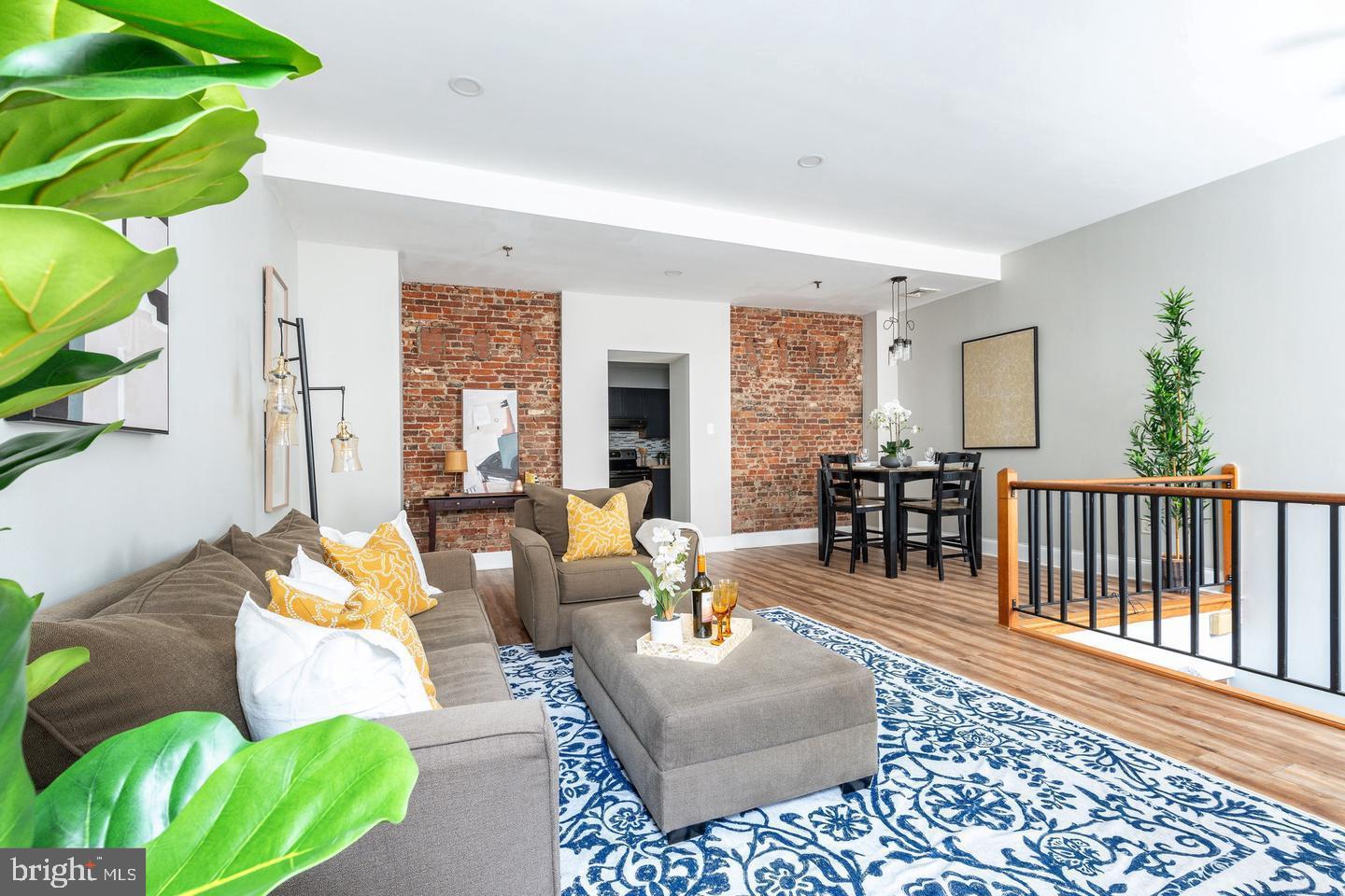 101 Arch Street, Unit 1J Philadelphia, PA 19106 - Photo 1 of 29 a living room with furniture and a window