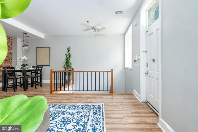 a living room with furniture and a rug