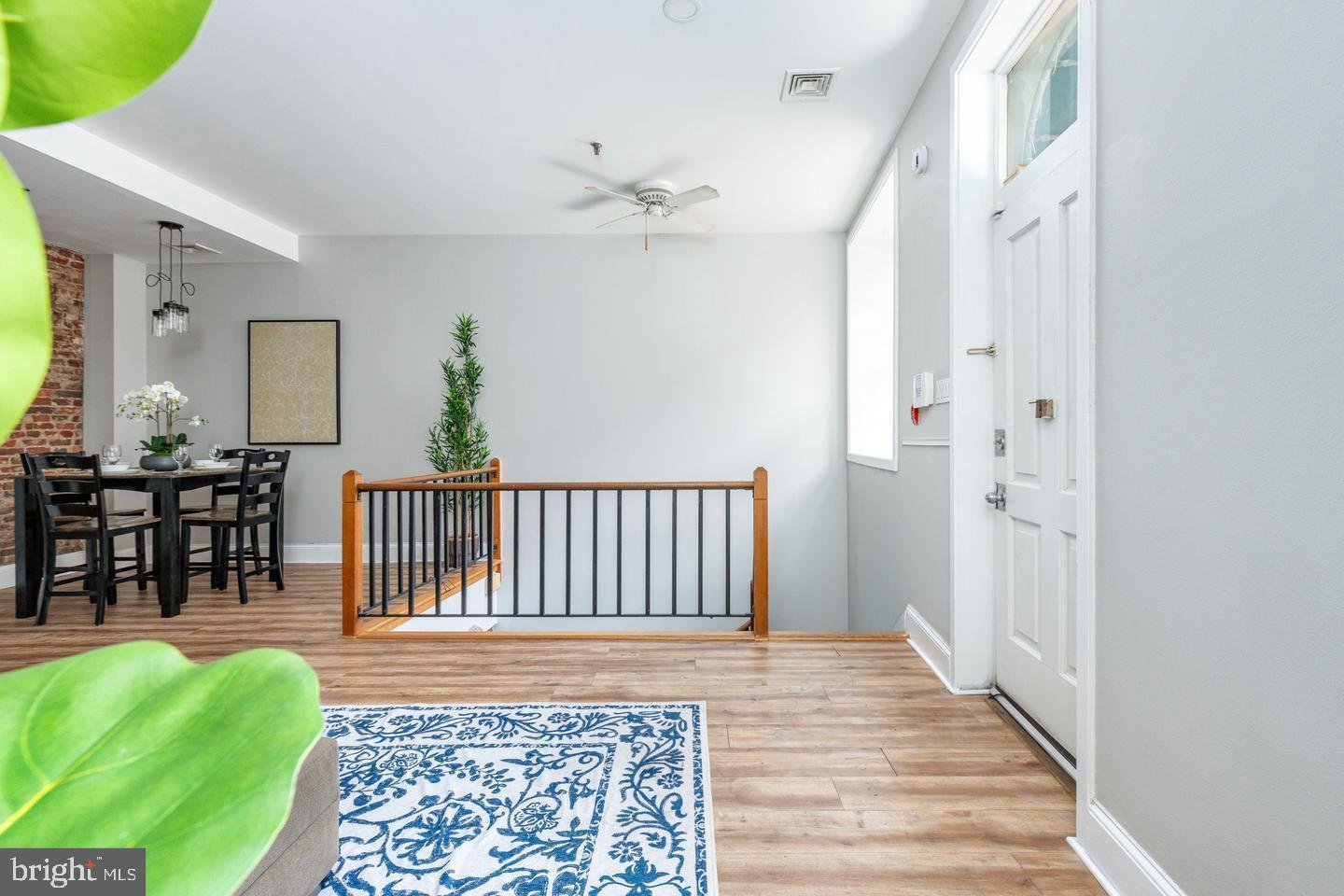 101 Arch Street, Unit 1J Philadelphia, PA 19106 - Photo 11 of 29 a living room with furniture and a rug