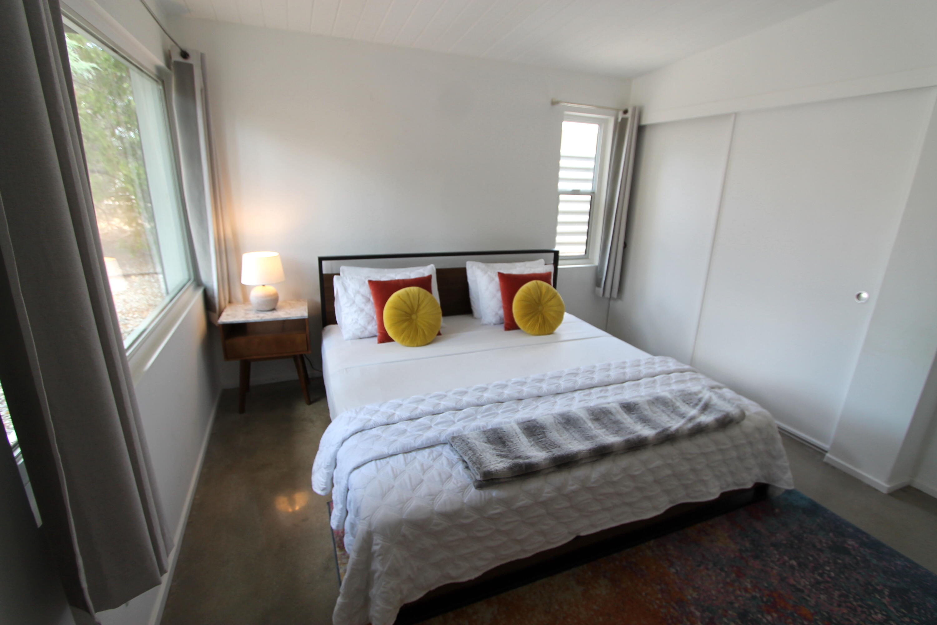 278 North Sunset Way Palm Springs, CA 92262 - Photo 11 of 14 a bed sitting in a bedroom next to a window