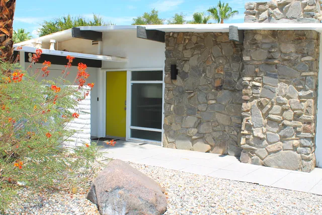 a view of a brick house with a outdoor space